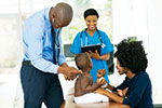  A child is examined by doctors