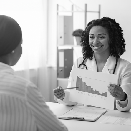 A health care provider showing a patient declining costs on a chart