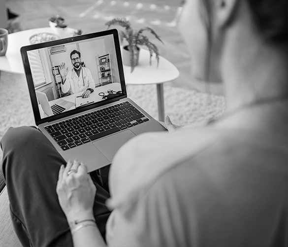 A young talk with a provider over the laptop.