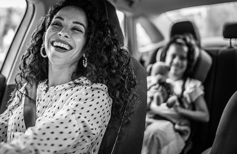 Mom driving daughter in the car