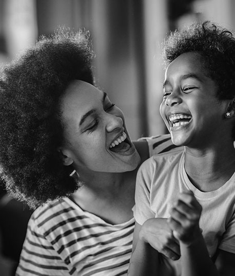 Young mother and child talking and laughing together